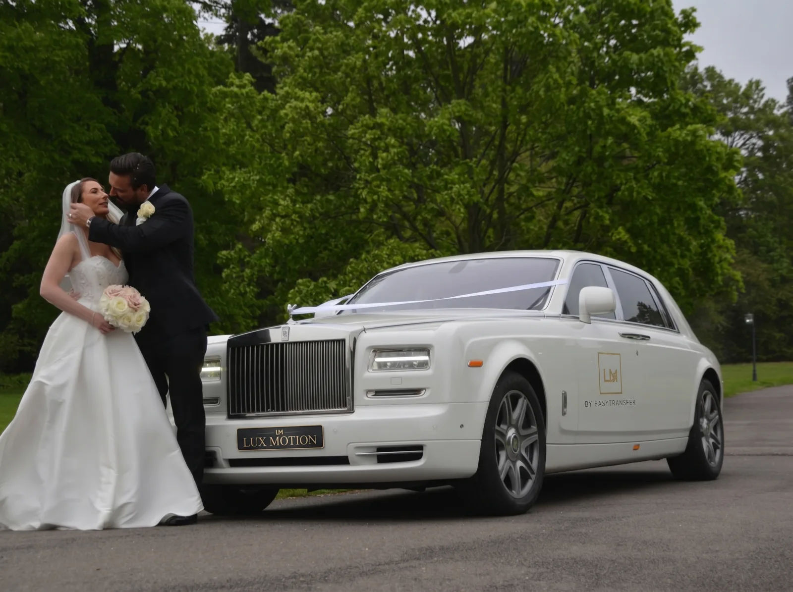 Chauffeur opening luxury vehicle door
